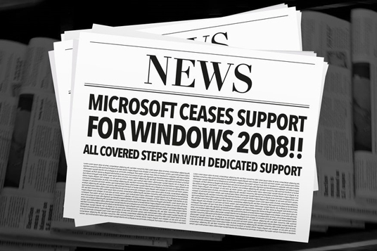 close up of newspaper stack with end of life for windows server 2008
